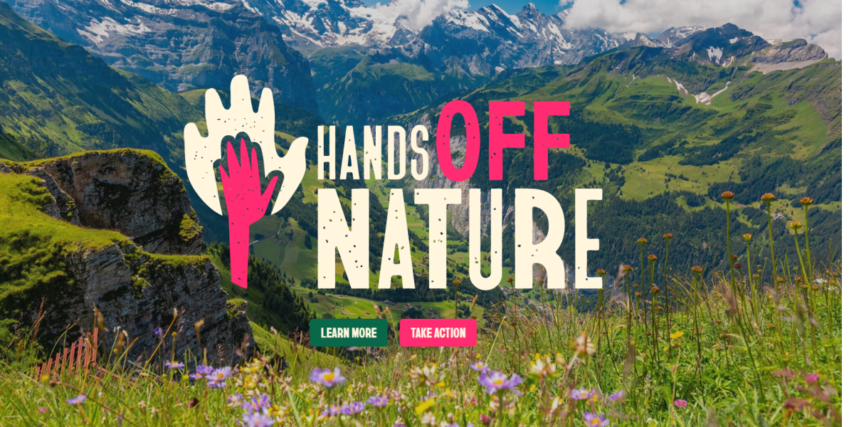 Hands Off Nature, im Hintergrund Berge